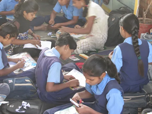 Children working with paper and materials during an art session