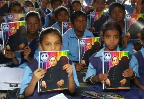 Students holding notebooks provided through community contributions